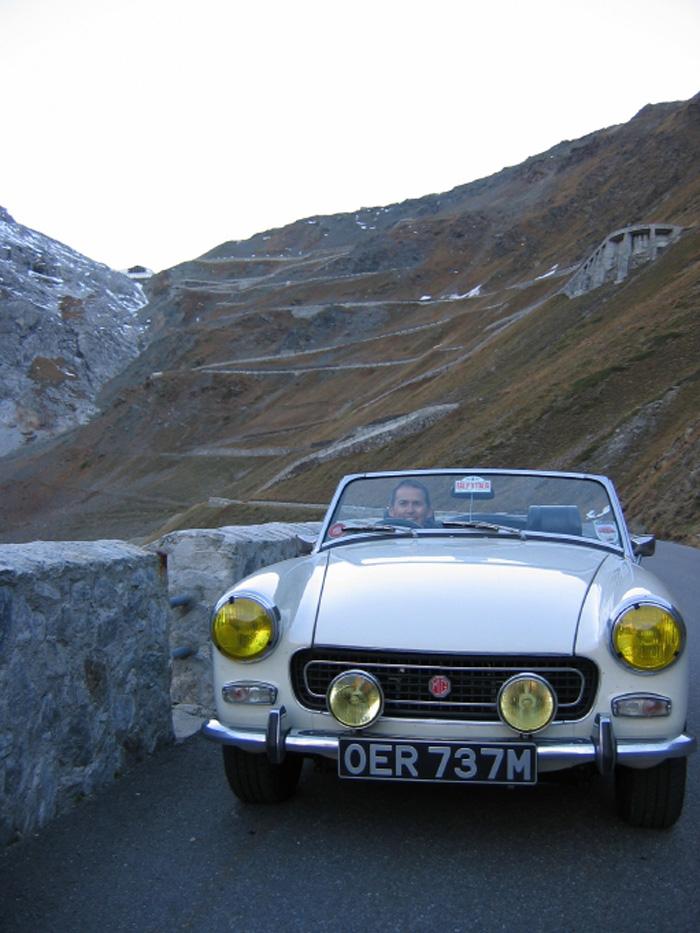 My 1974 Midget and I descending the Stelvio Pass in the Italian Alps, October 2007